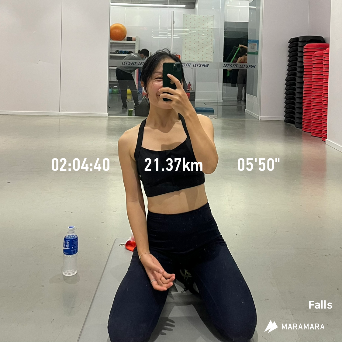 Falls posing after finish her half-marathon on a treadmill.