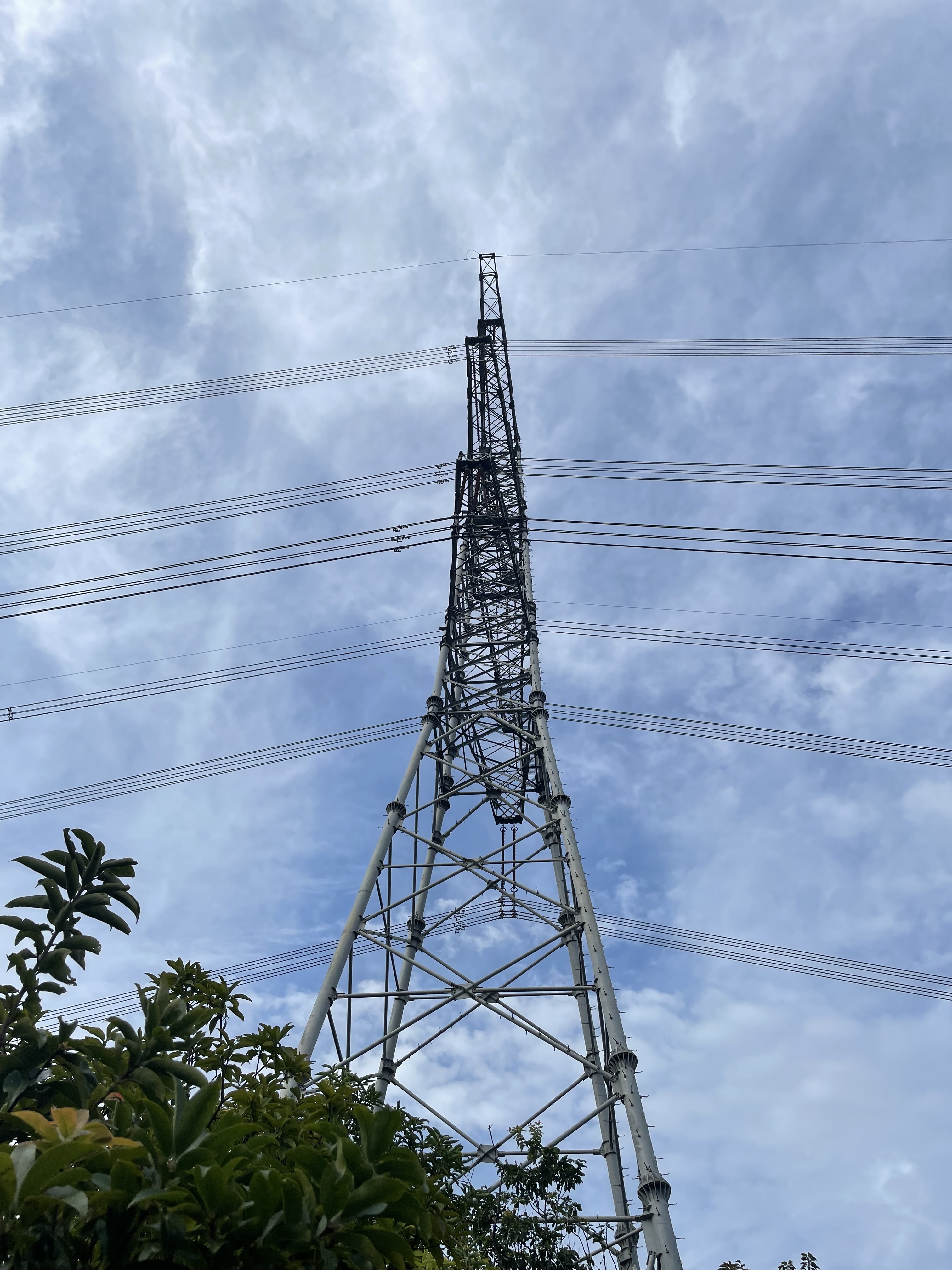 Power pole against the blue sky.