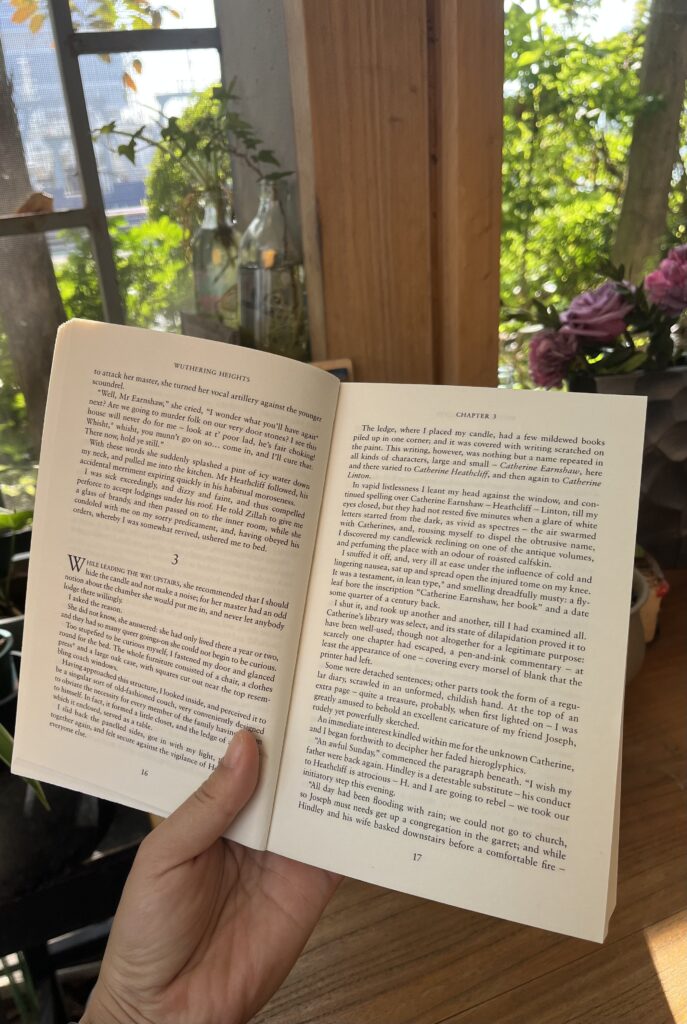 Falls holding a book