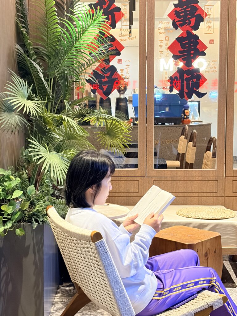 A girl reading outside