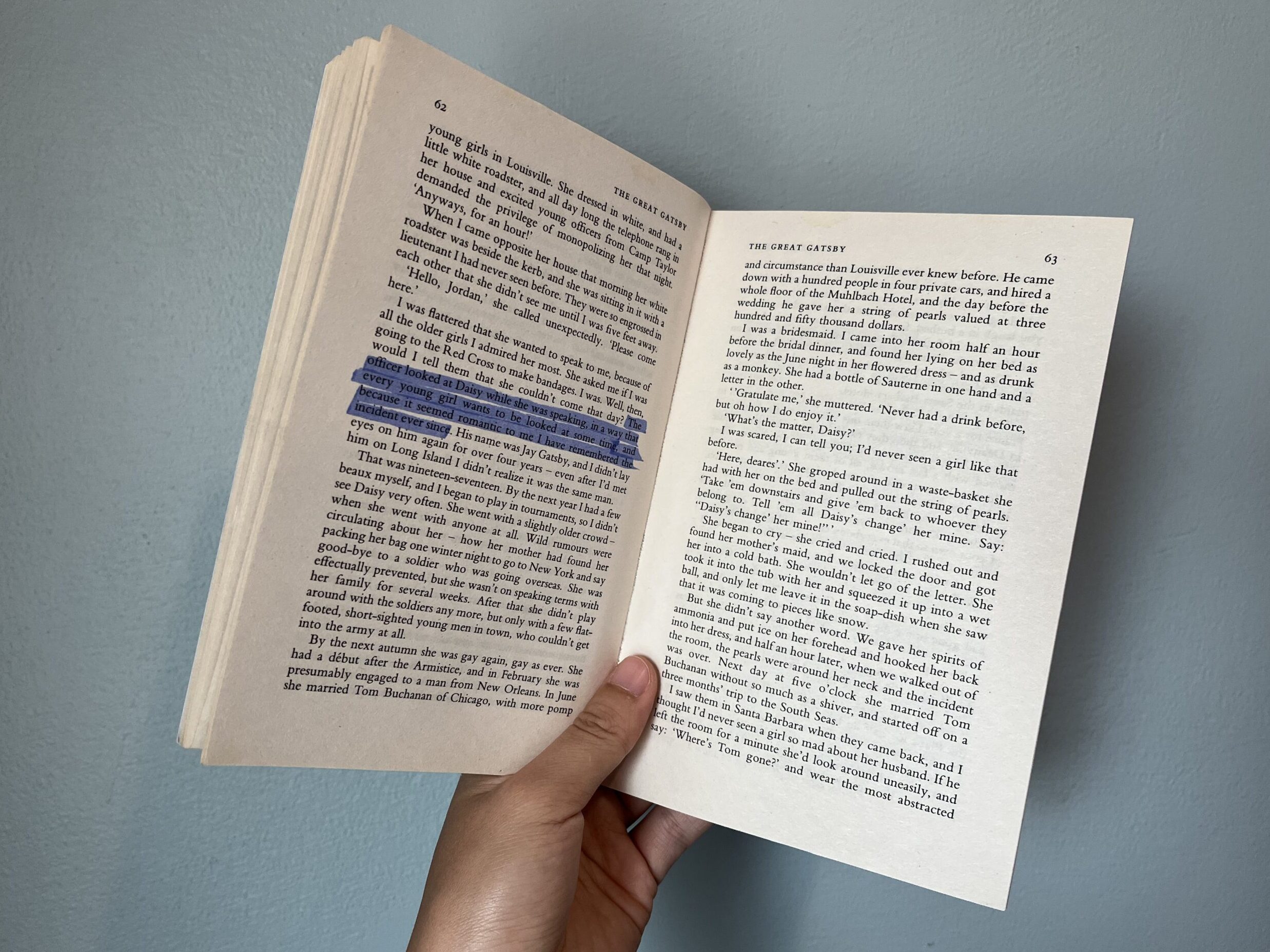 A photo of The Great Gatsby open to a page, showcasing the text of the novel.