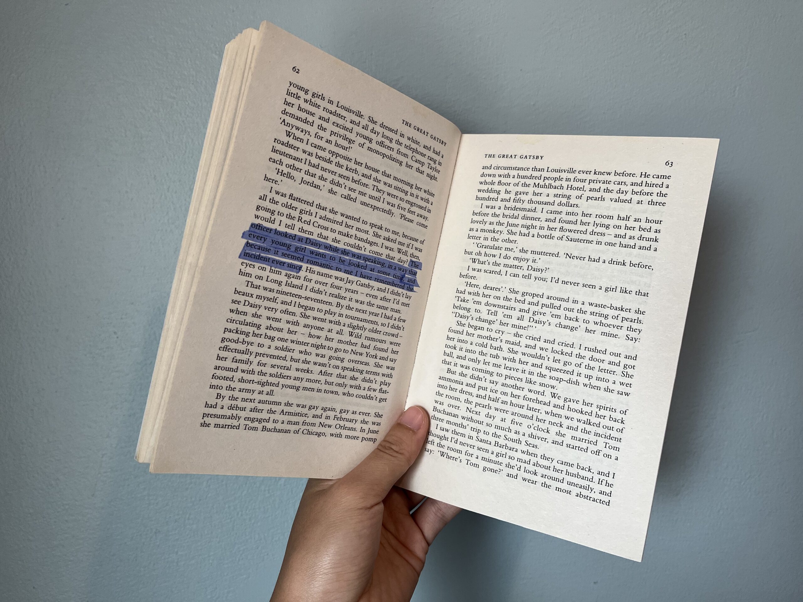A photo of The Great Gatsby open to a page, showcasing the text of the novel.