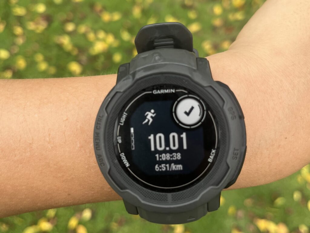Garmin watch showing a 10K run completed during my city run