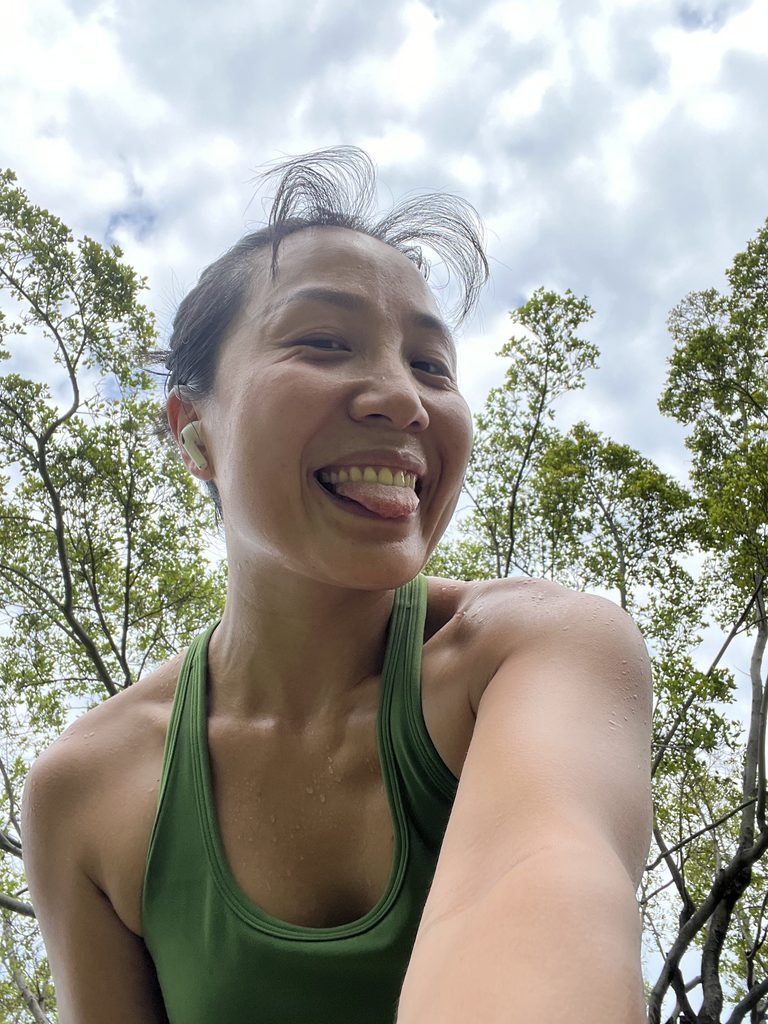 Taking a playful photo against a blue sky, sticking my tongue out