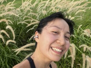 A joyful post-run selfie after a rainy evening, capturing a calm and refreshed outdoor moment.