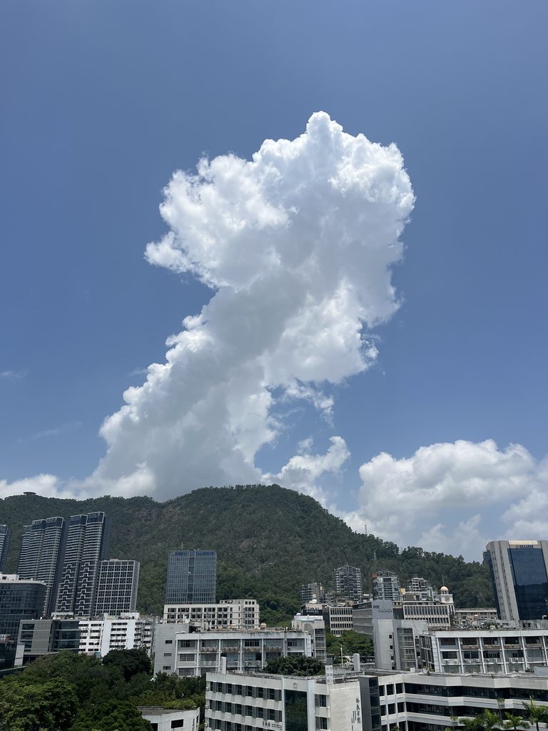 A clear blue sky with white clouds