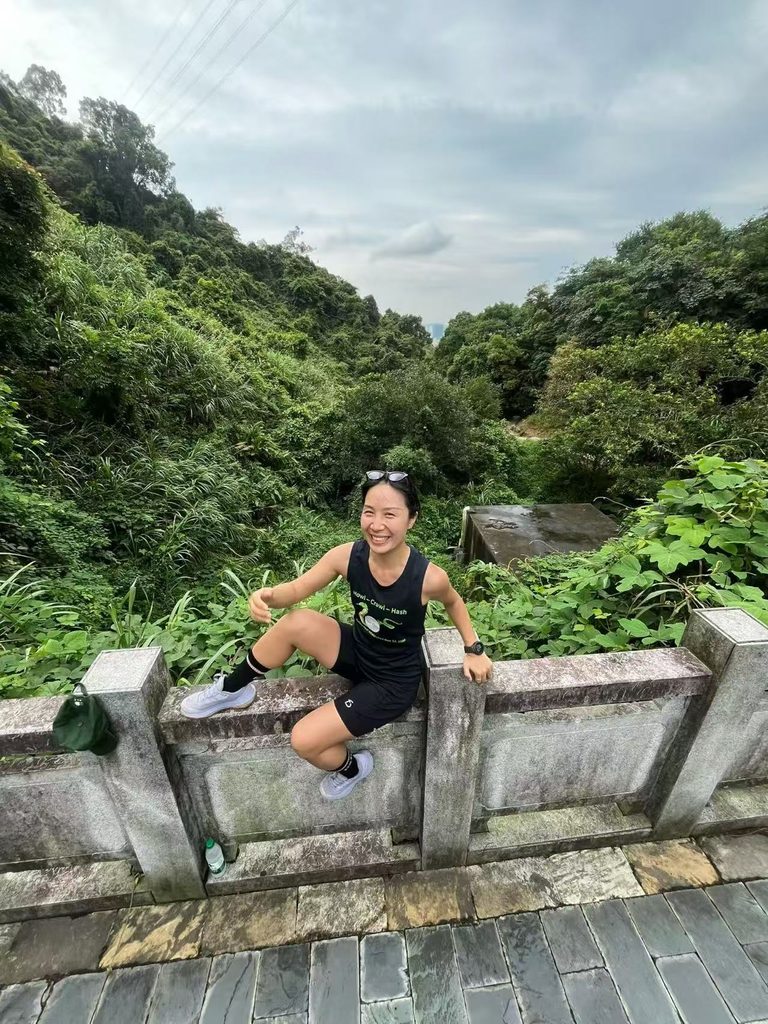 Falls sitting on a bridge surrounded by a lush green forest