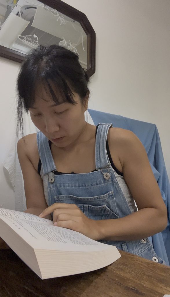 Falls reading The Vanishing Half during Fallina reading session
