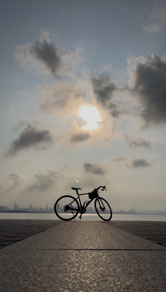 Bike facing the morning sun on a peaceful autumn morning