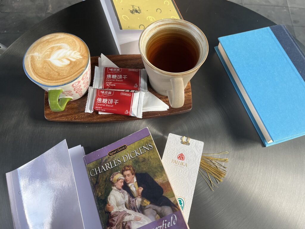 Books and coffee on the table during a Fallina reading session