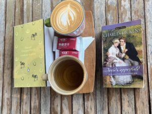 David Copperfield book with tea and coffee on a table